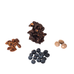 Cluster of blueberry, cluster of pecans, cluster of nutmeg, and cluster of chocolate superfood snack